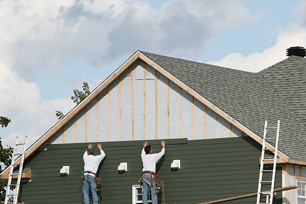 Professional Siding Installation technician working in Wellsville, OH